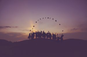 Grads tossing hat