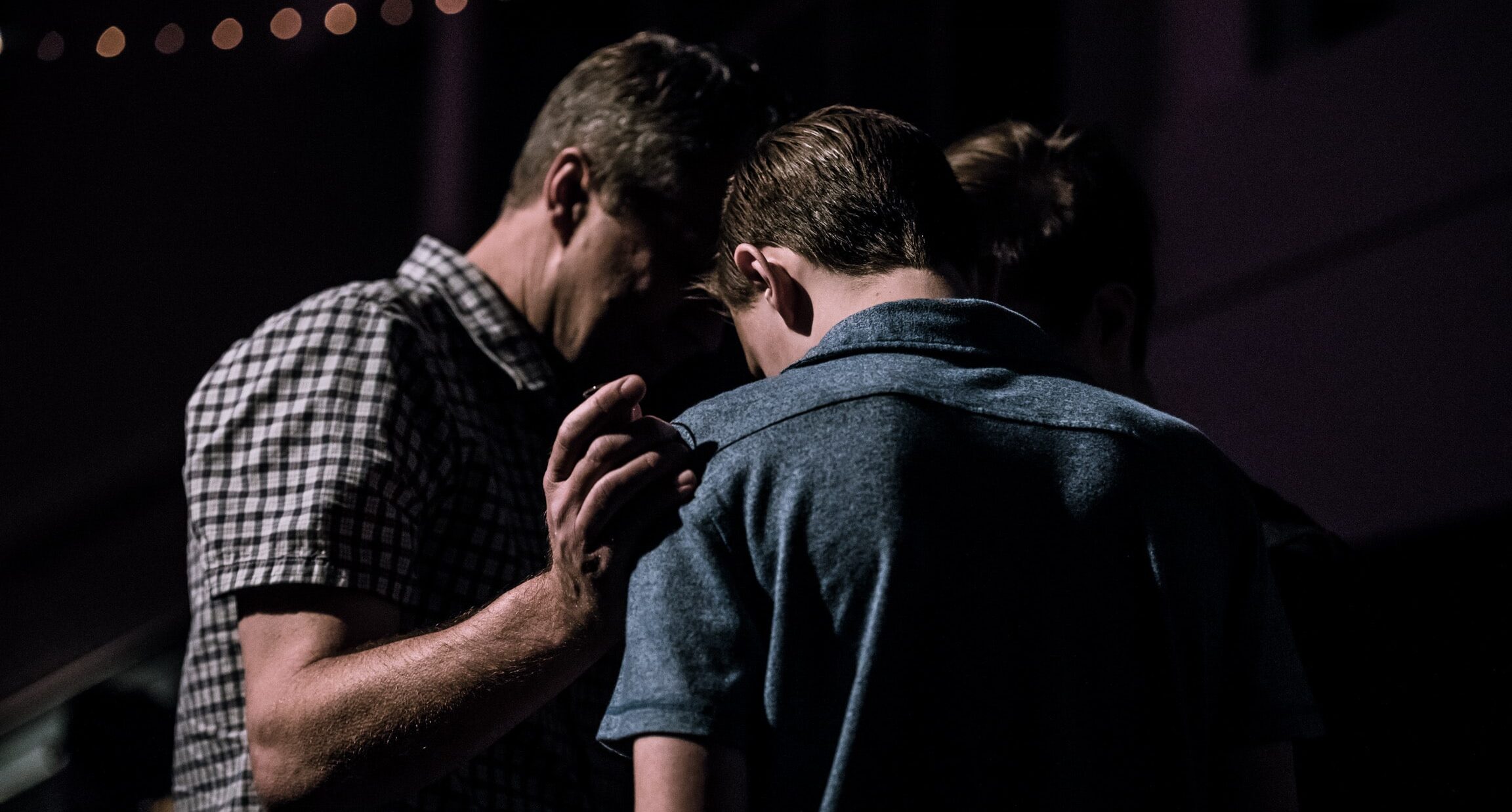 Men praying together