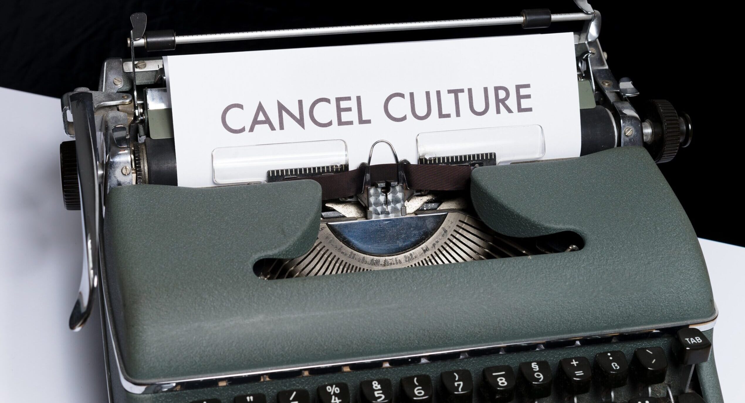 Typewriter with page saying "cancel culture"