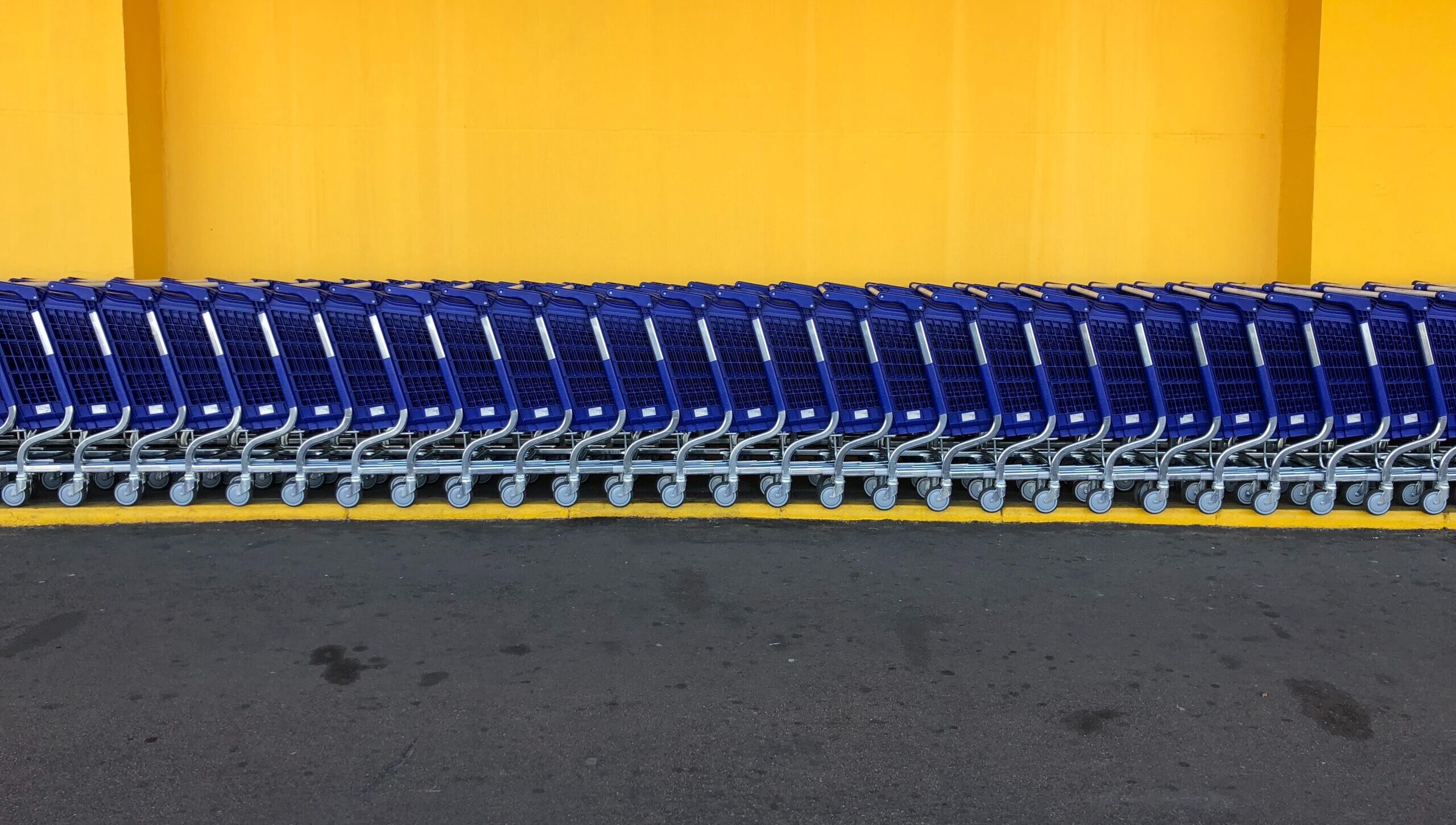 line of blue shopping carts