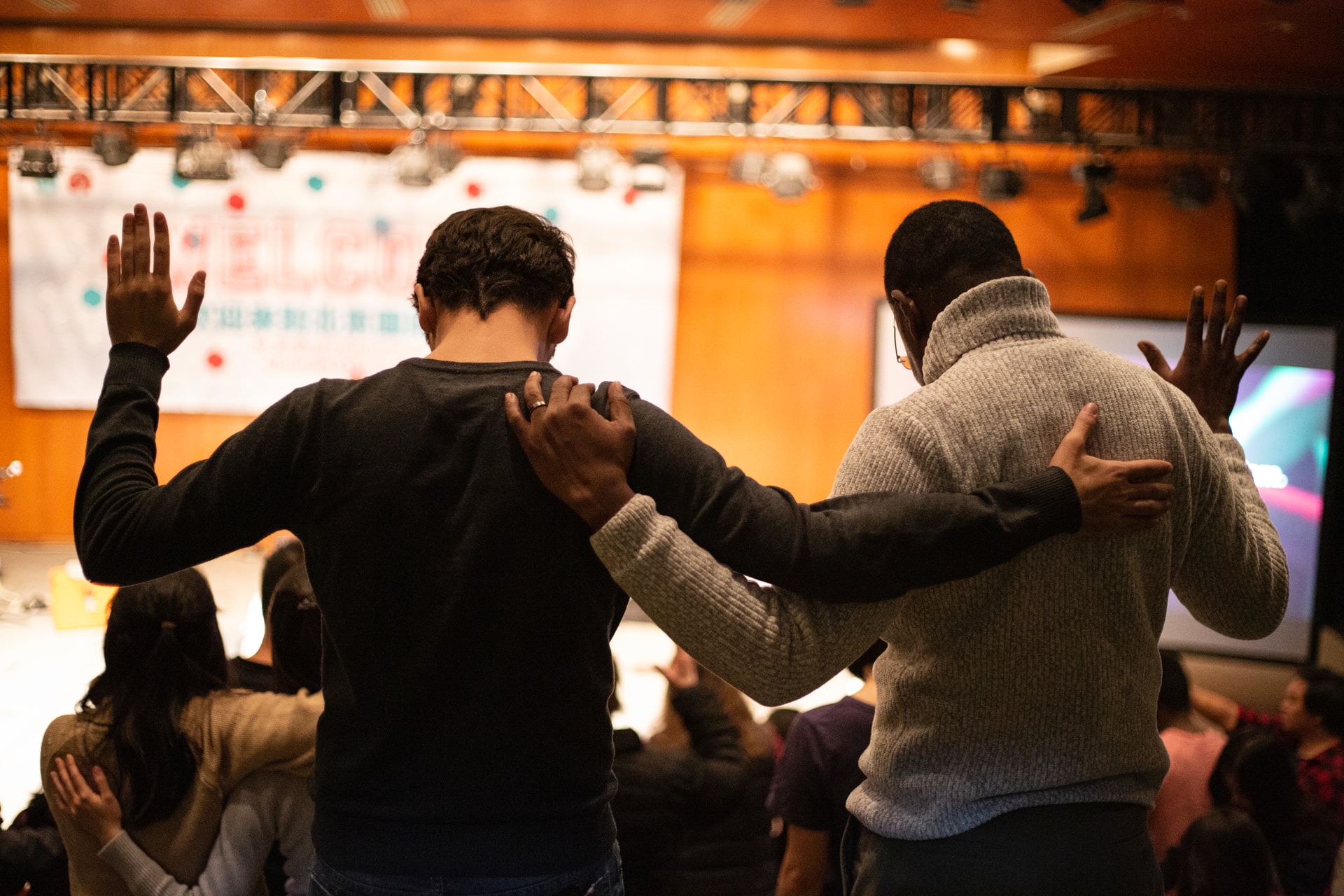 two men praying together