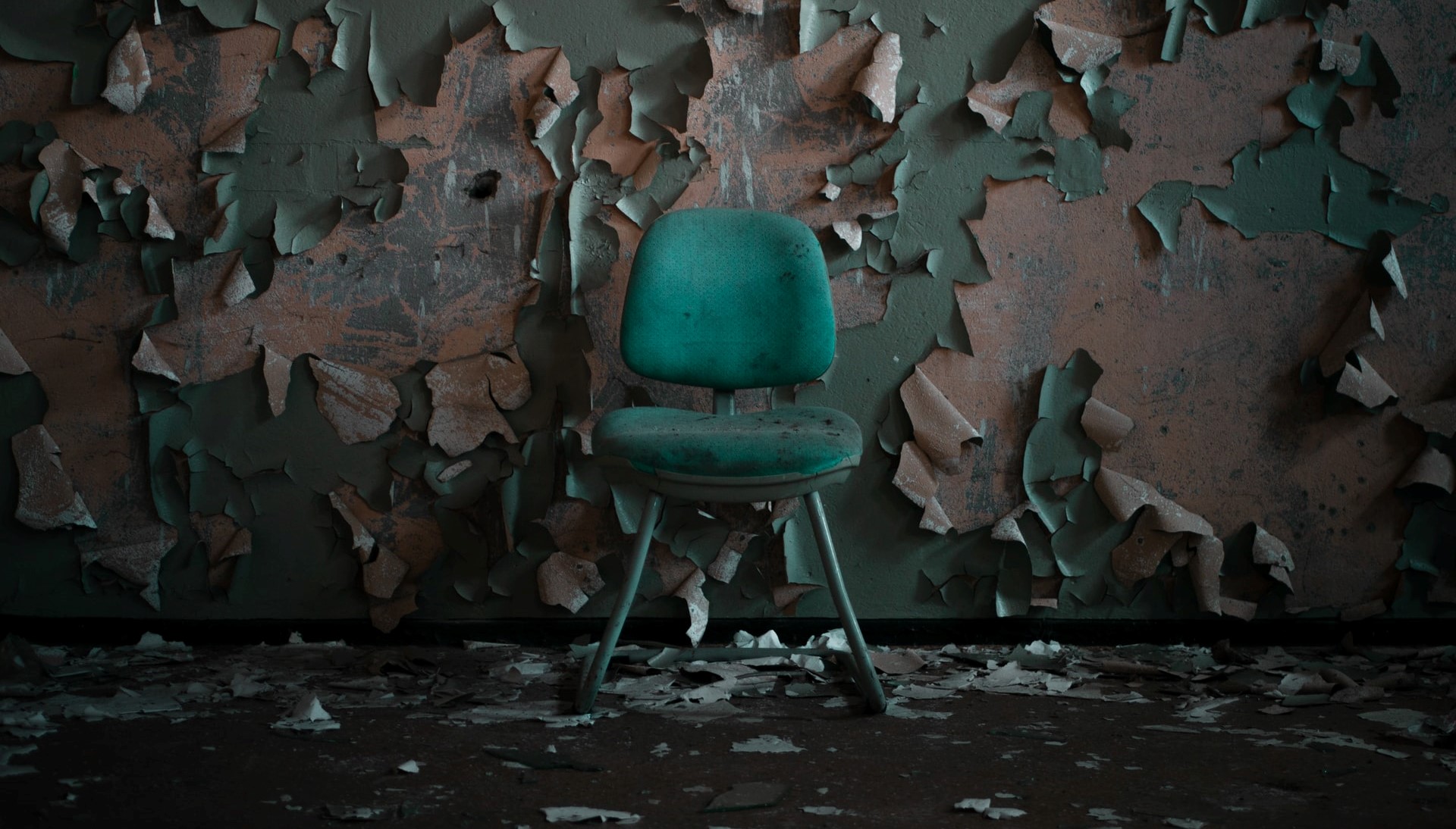 water damaged room with green chair