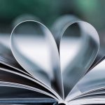 A book with pages folded into the shape of a heart